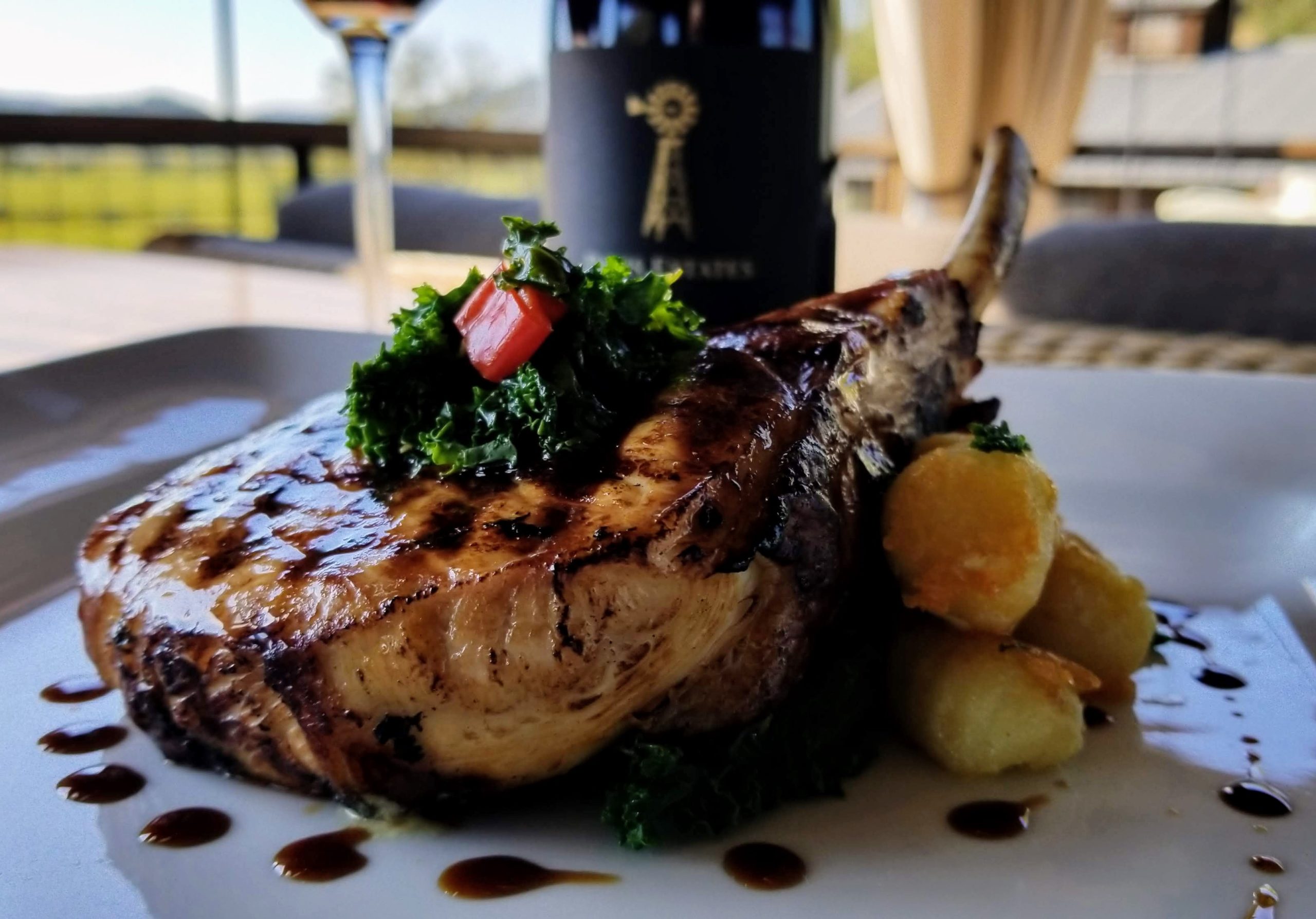 Grilled Sweet Tea Brined Pork Chops with Sautéed Kale and Tempura Vegetables paired with Davis Estates Pinot Noir
