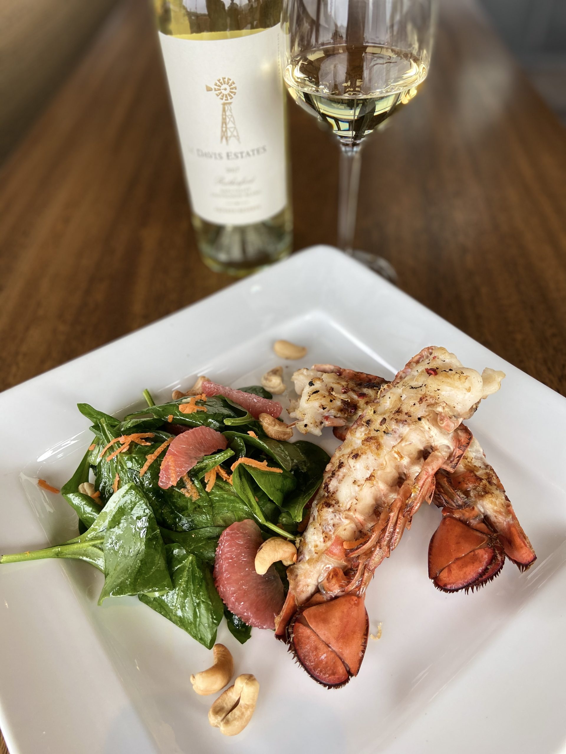 Grilled Lobster Tails with Ginger Grapefruit, Pink Peppercorn Butter and Spinach Salad, paired with Davis Estates Sauvignon Blanc