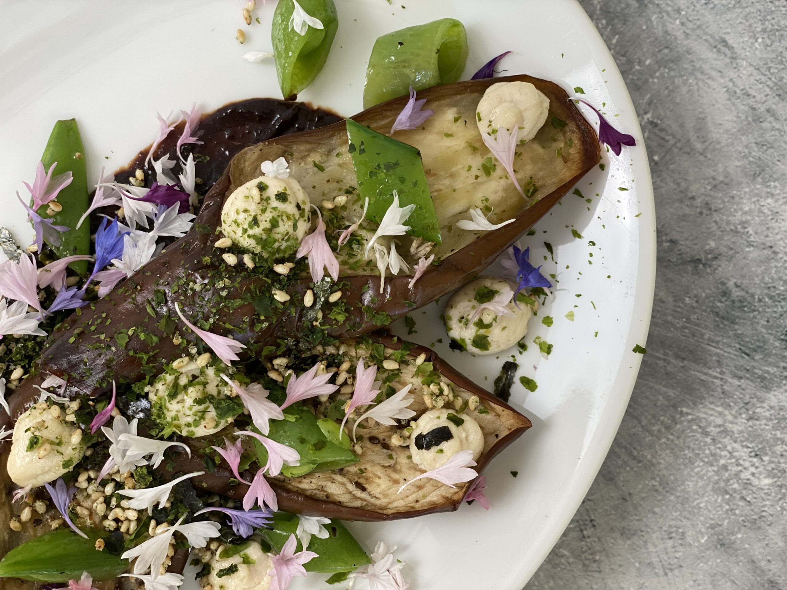 Delightful Japanese Eggplant with Black Garlic Miso and topped with Furikake.