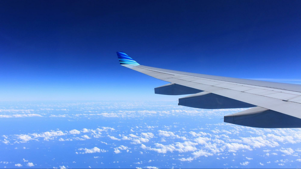 looking at the clouds far below from an airplane, as shown in the Davis Estate wine blog post featuring a Napa valley airports guide and flights to Napa