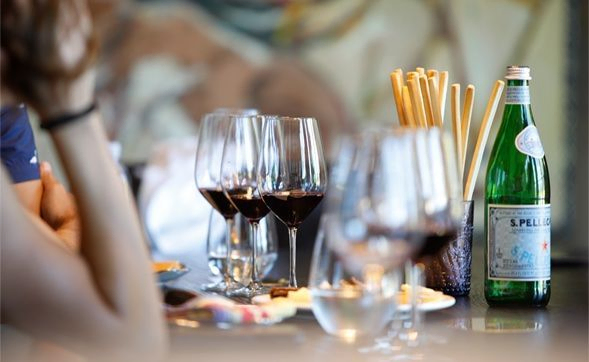 Wine glasses sit on a table at a wine tasting at The Vineyardist | Best Wineries in Calistoga