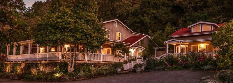 A comforting country house sits surrounded by trees | Best Calistoga Hotels