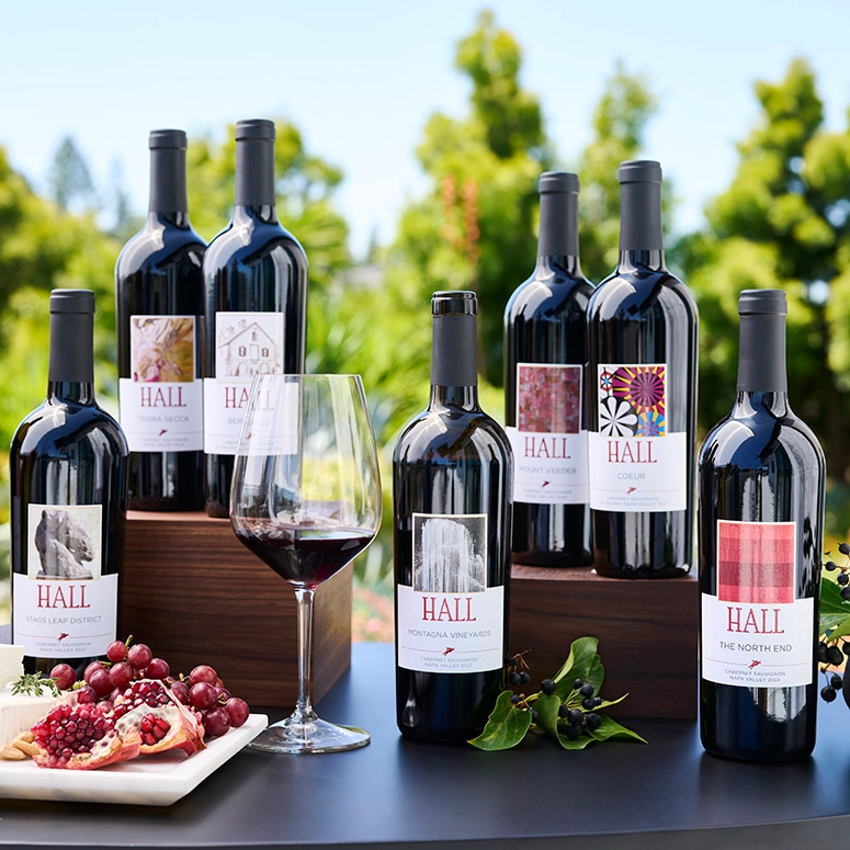 Hall Napa Valley wine bottles with glass and grapes