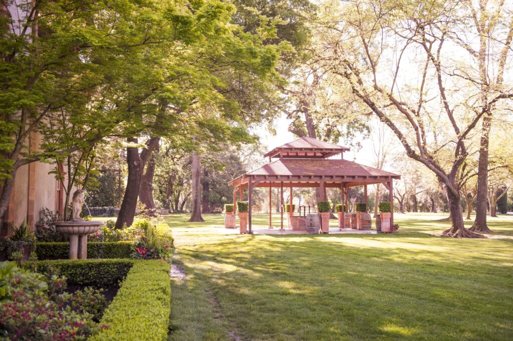 Charming garden gazebo surrounded by trees and greenery