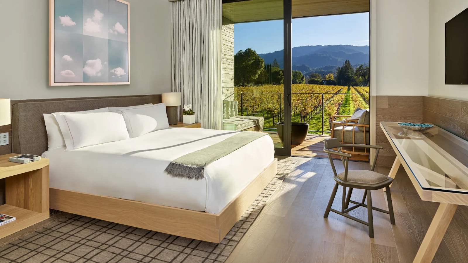 Bright bedroom with vineyard view and outdoor seating