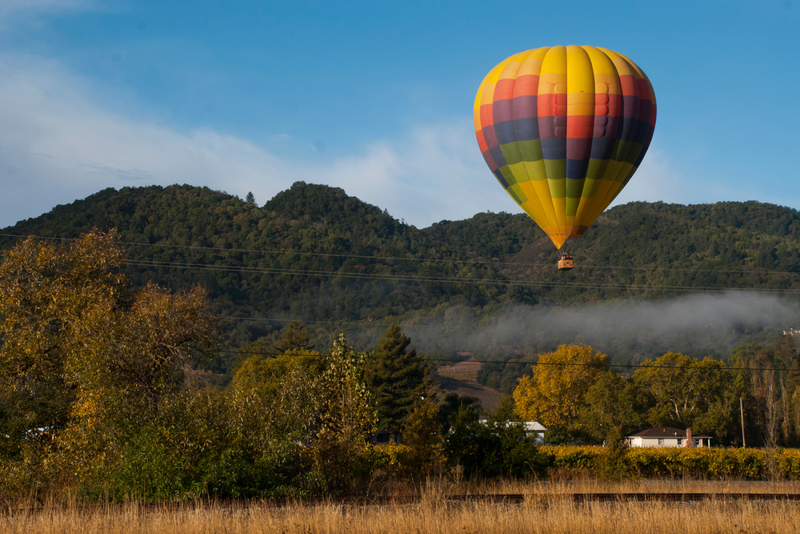 Colorful hot air balloon over Davis Estates hills