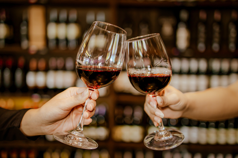 Clinking wine glasses at Davis Estates