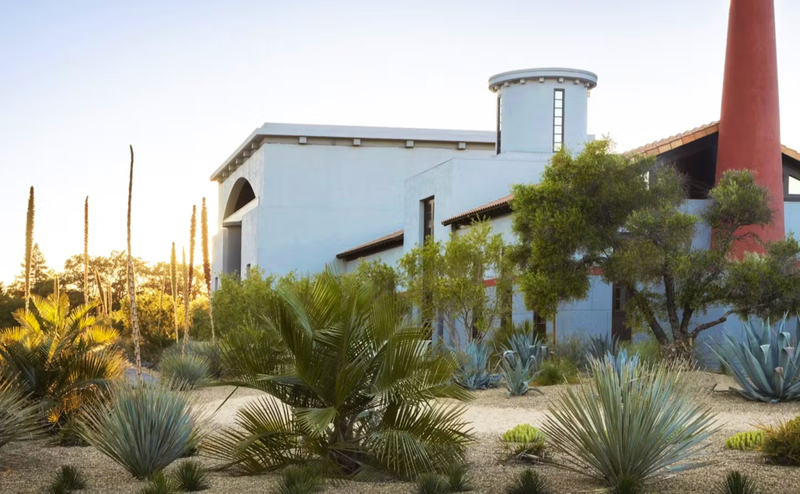 los Pegase is surrounded by trees and desert plants | Best Wineries in Calistoga