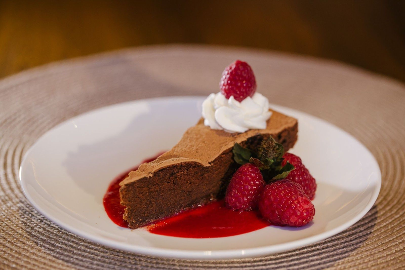 Chocolate cake with raspberries and cream at Davis Estates