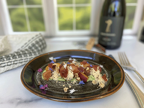Plated gourmet dessert with Davis Estates wine in background