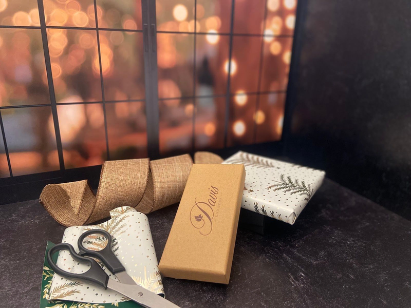Davis Estates holiday gift wrapping with ribbon and boxes
