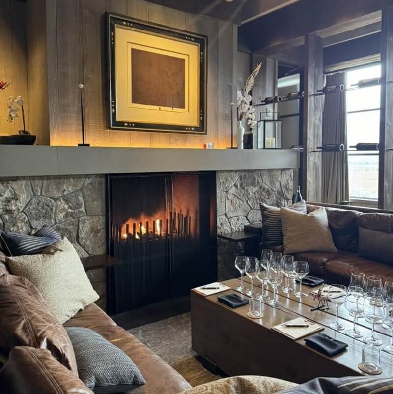Cozy wine tasting room with fireplace