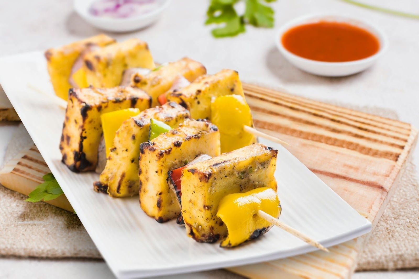 Grilled paneer skewers with bell peppers and dipping sauce