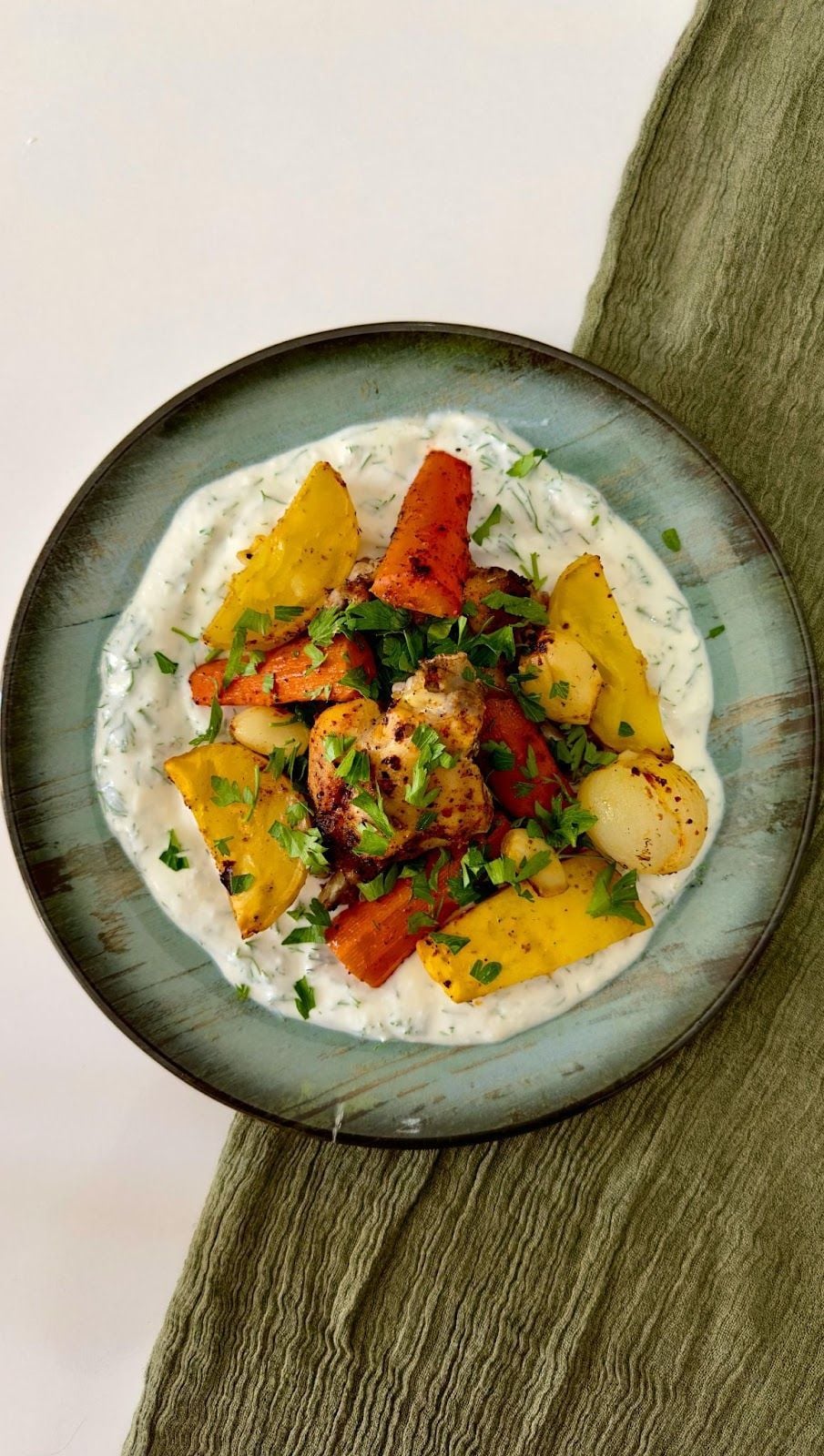 Roasted chicken with vegetables on herb sauce